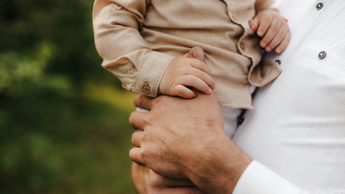 a man and woman holding hands